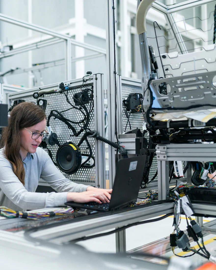 Engineer working on industrial automation equipment